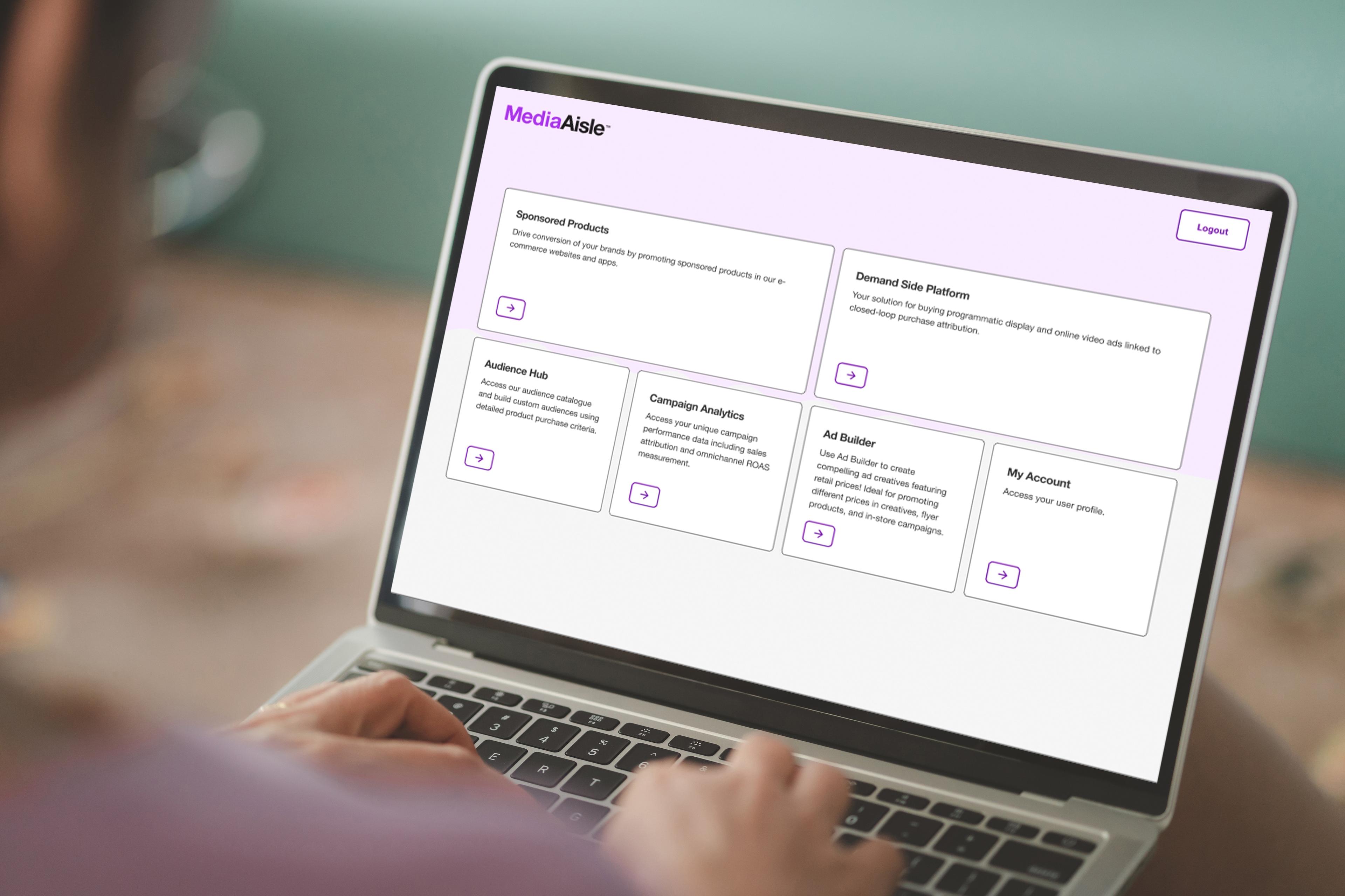 A businessperson views the MediaAisle platform on their laptop.