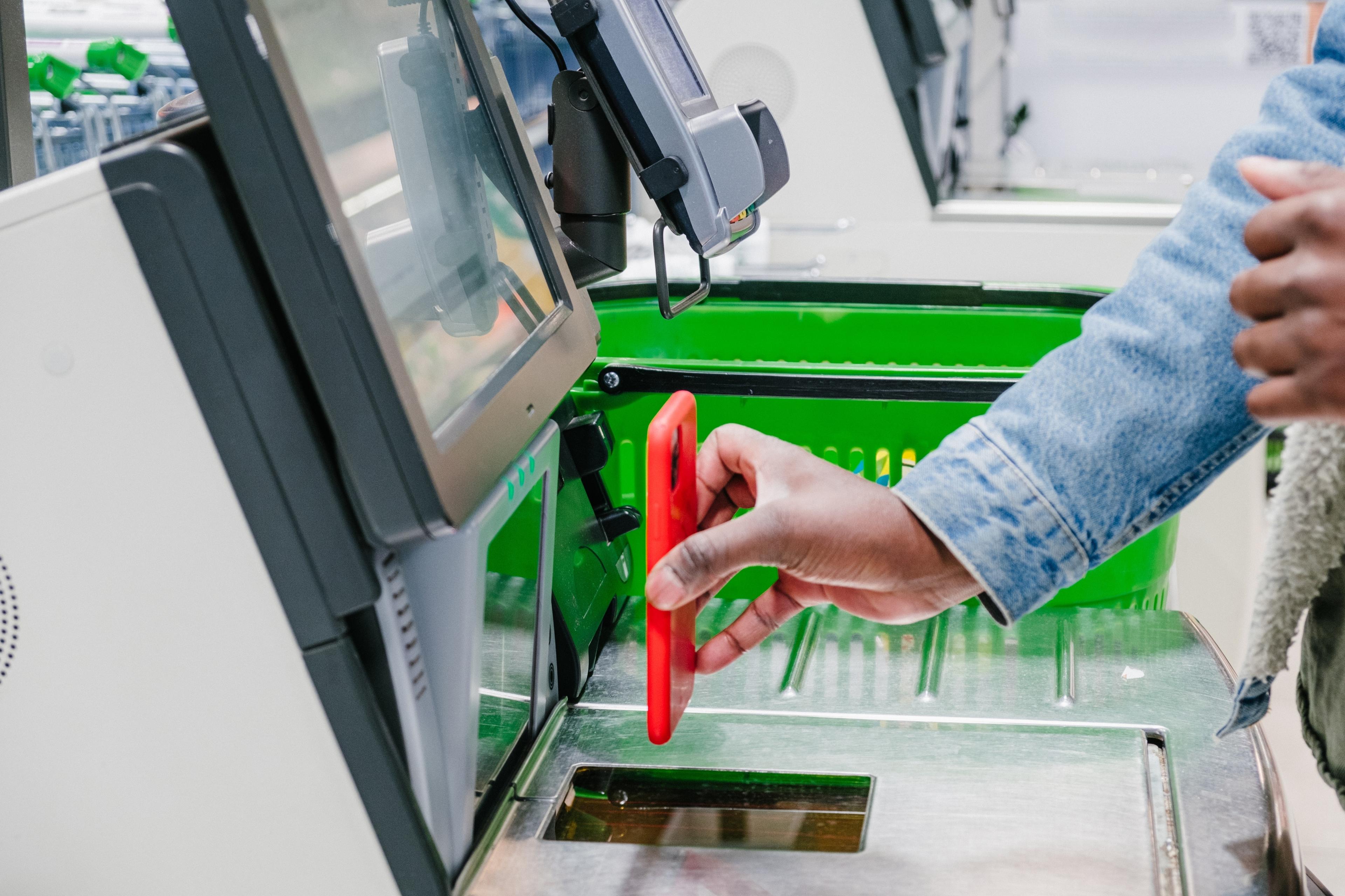 Scanning PC Optimum barcode at grocery store checkout retail media
